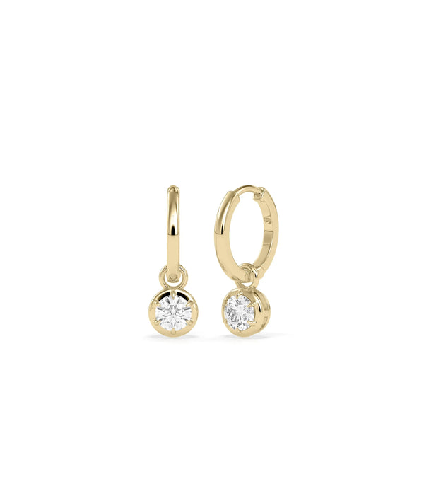 Diamond dangle earrings bezel set design solid gold protective settings closeup detail alternate view