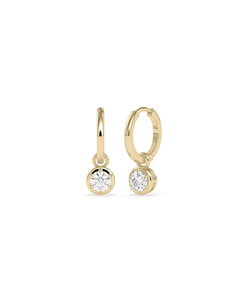 Diamond dangle earrings bezel set design solid gold protective settings closeup detail