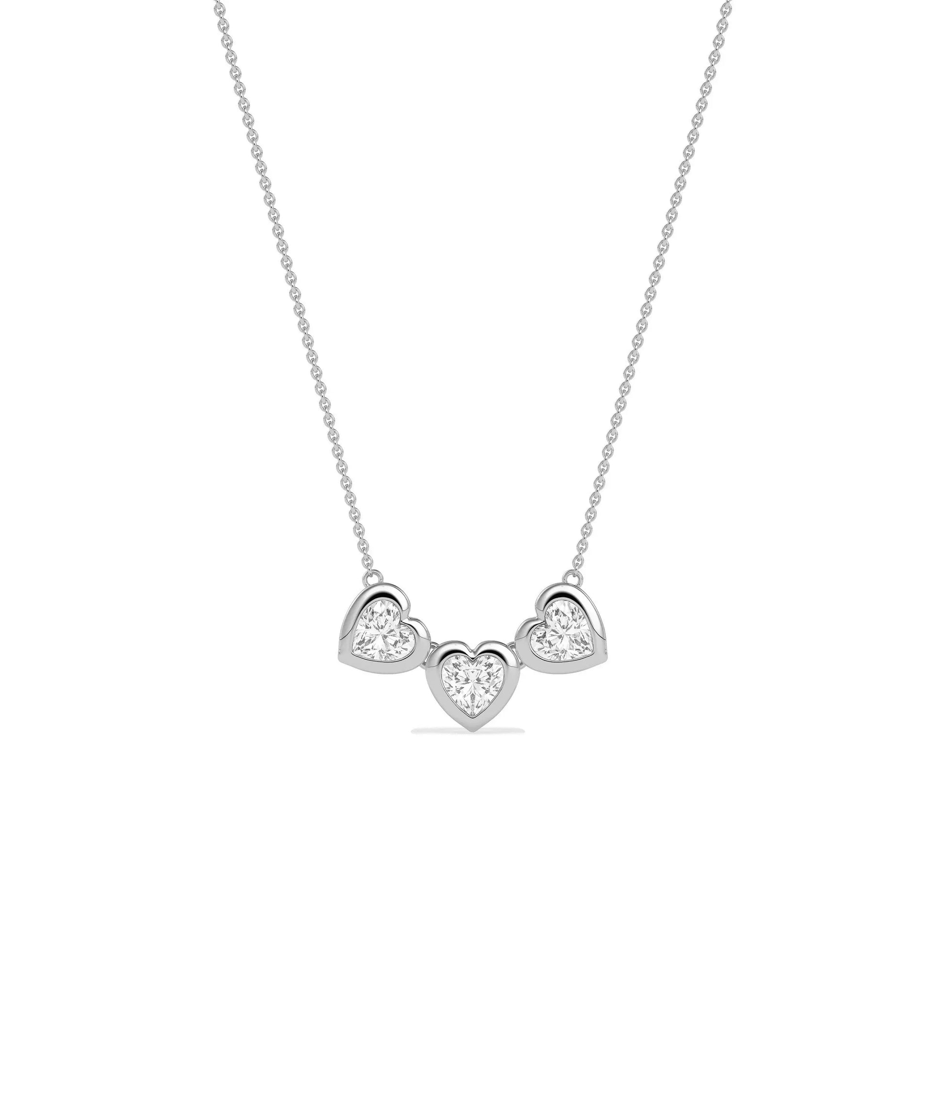 Three heart diamond necklace bubble bezel settings solid gold chain closeup detail