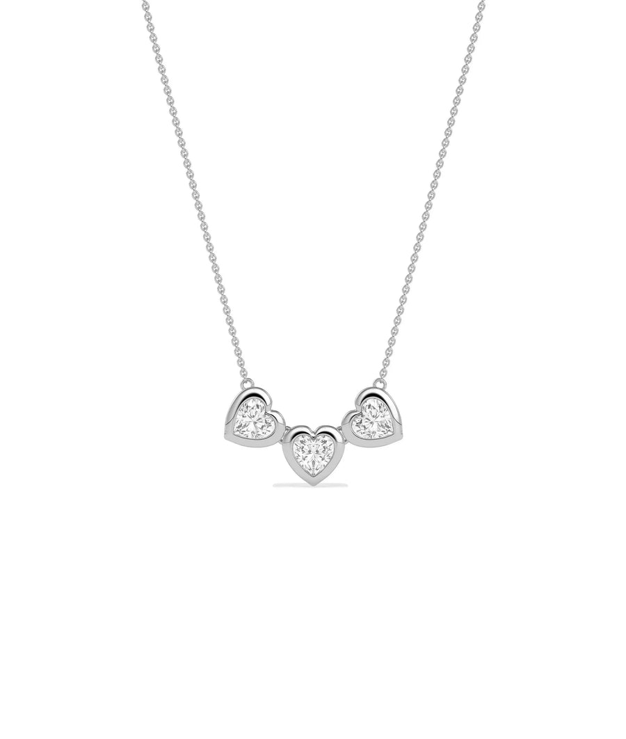 Three heart diamond necklace bubble bezel settings solid gold chain closeup detail