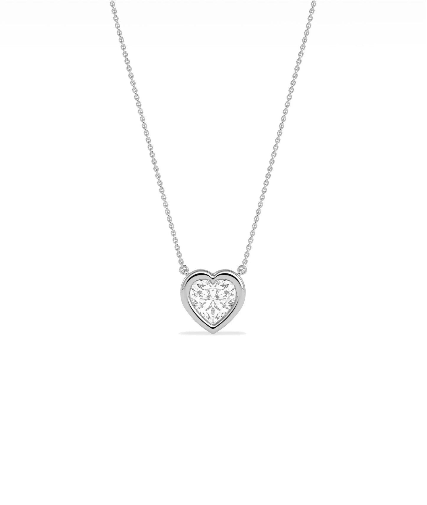 Heart shaped diamond necklace in bubble bezel setting solid gold chain closeup view