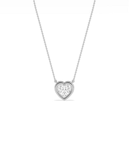 Heart shaped diamond necklace in bubble bezel setting solid gold chain closeup view