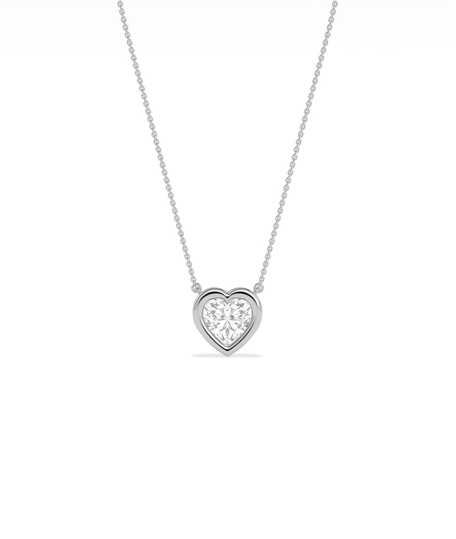 Heart shaped diamond necklace in bubble bezel setting solid gold chain closeup view