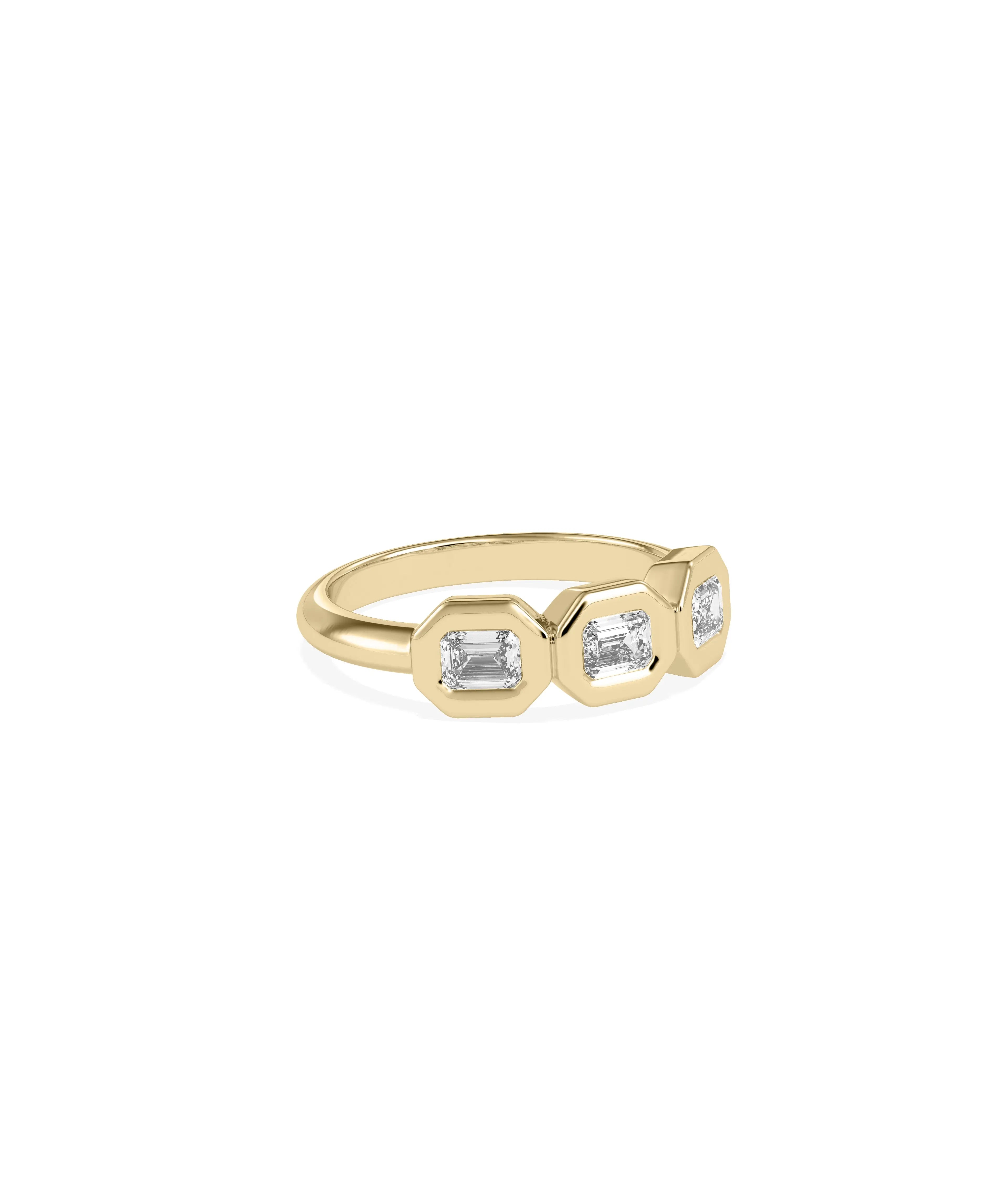 Three stone emerald cut ring showing bubble bezel frames and linear design