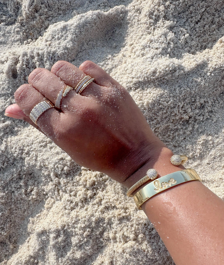 Pyramid design ring on hand highlighting comfortable wearable stackable styling