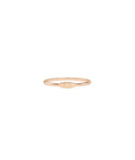 Embossed Single Initial Petite Ring on hand displaying delicate minimal sizing