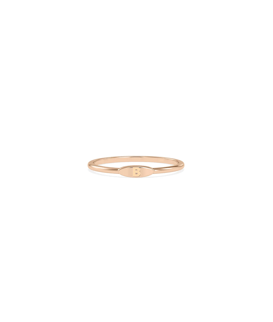 Embossed Single Initial Petite Ring on hand displaying delicate minimal sizing