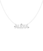Close-up showing diamond-set name lettering with gold heart accent detail