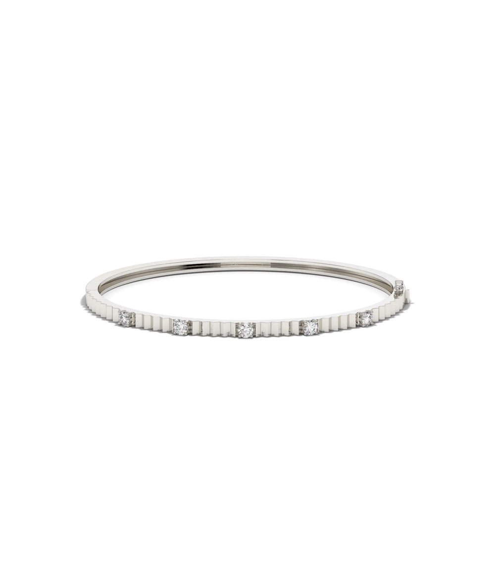 White gold fluted station diamond bangle with elegant rhythmic diamond pattern
