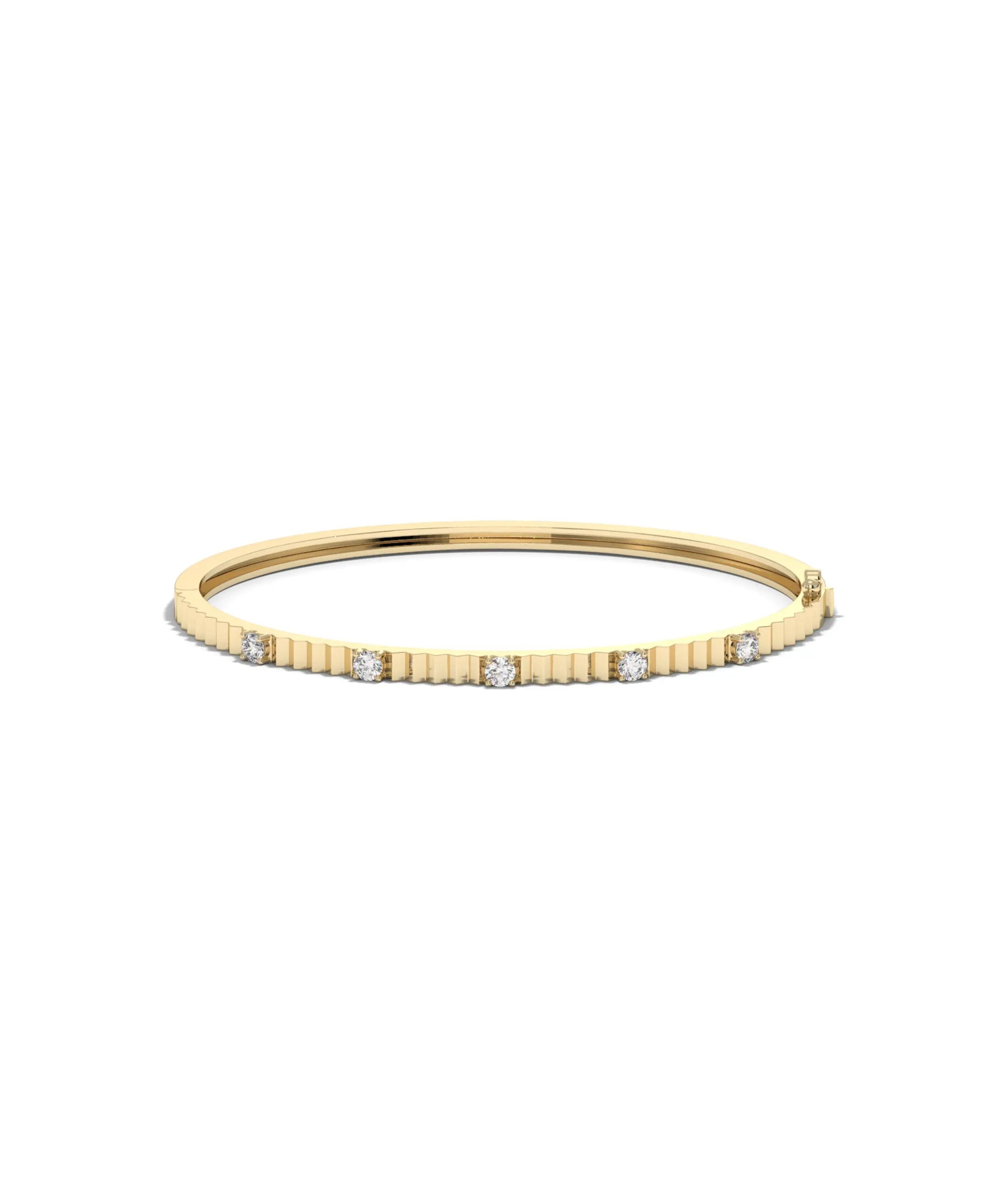 Fluted station diamond bangle front view in yellow gold with interval sparkle
