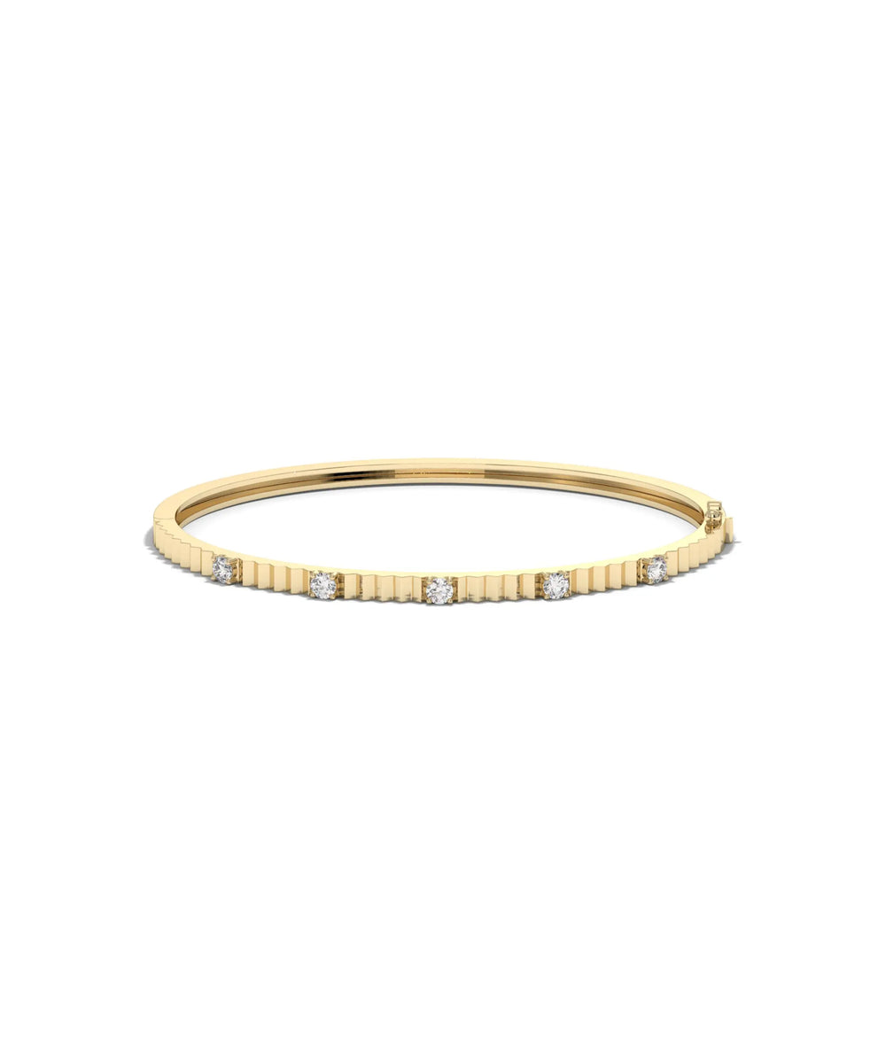 Fluted station diamond bangle front view in yellow gold with interval sparkle