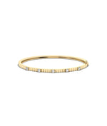 Fluted station diamond bangle front view in yellow gold with interval sparkle