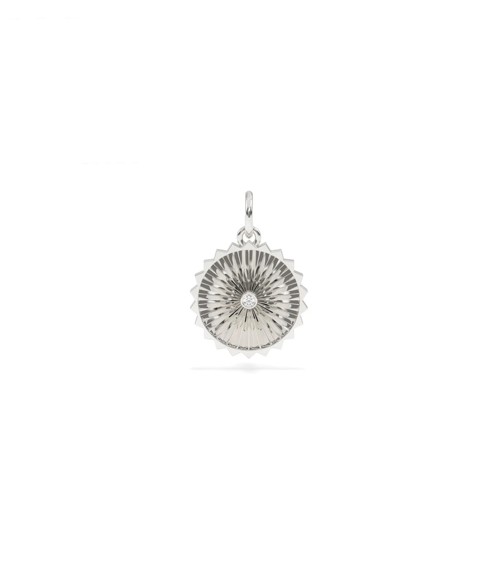 White gold fluted circle charm with understated circular shape and texture