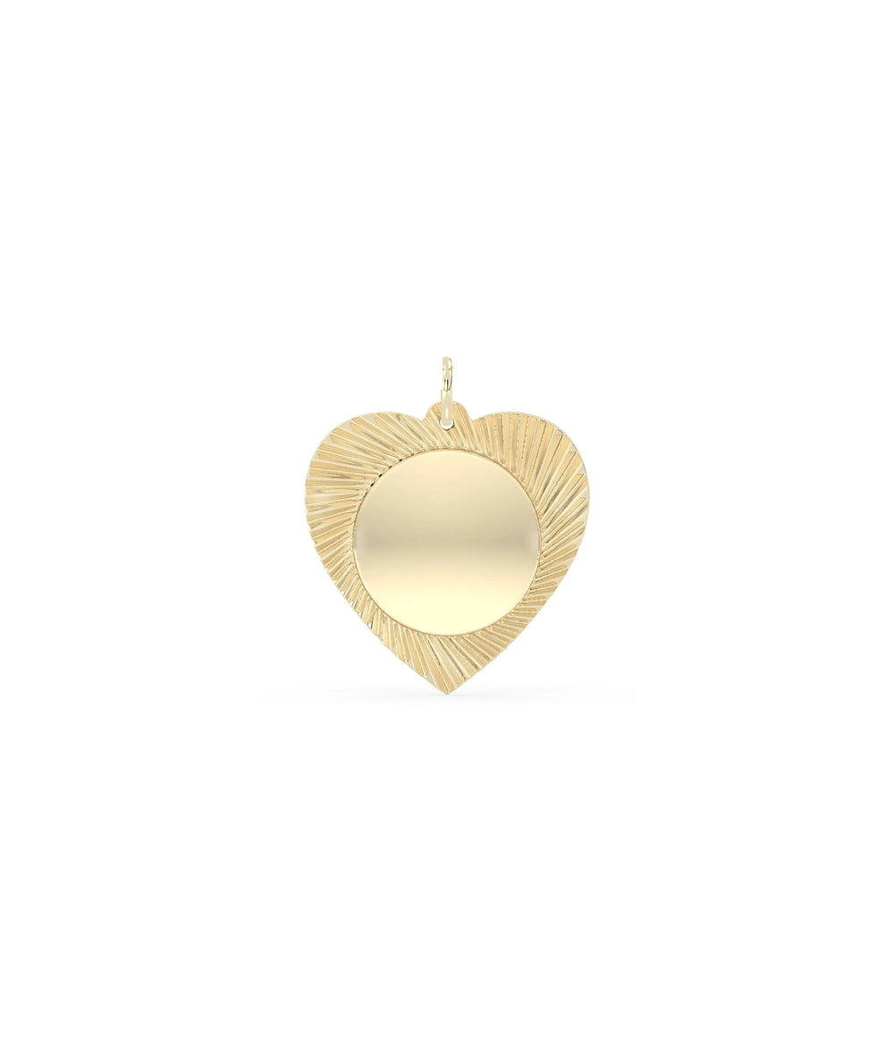 Fluted circle and heart charm front view in yellow gold with dual symbol design