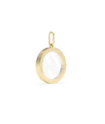 Side angle solid gold circle glass locket charm showing latch mechanism detail