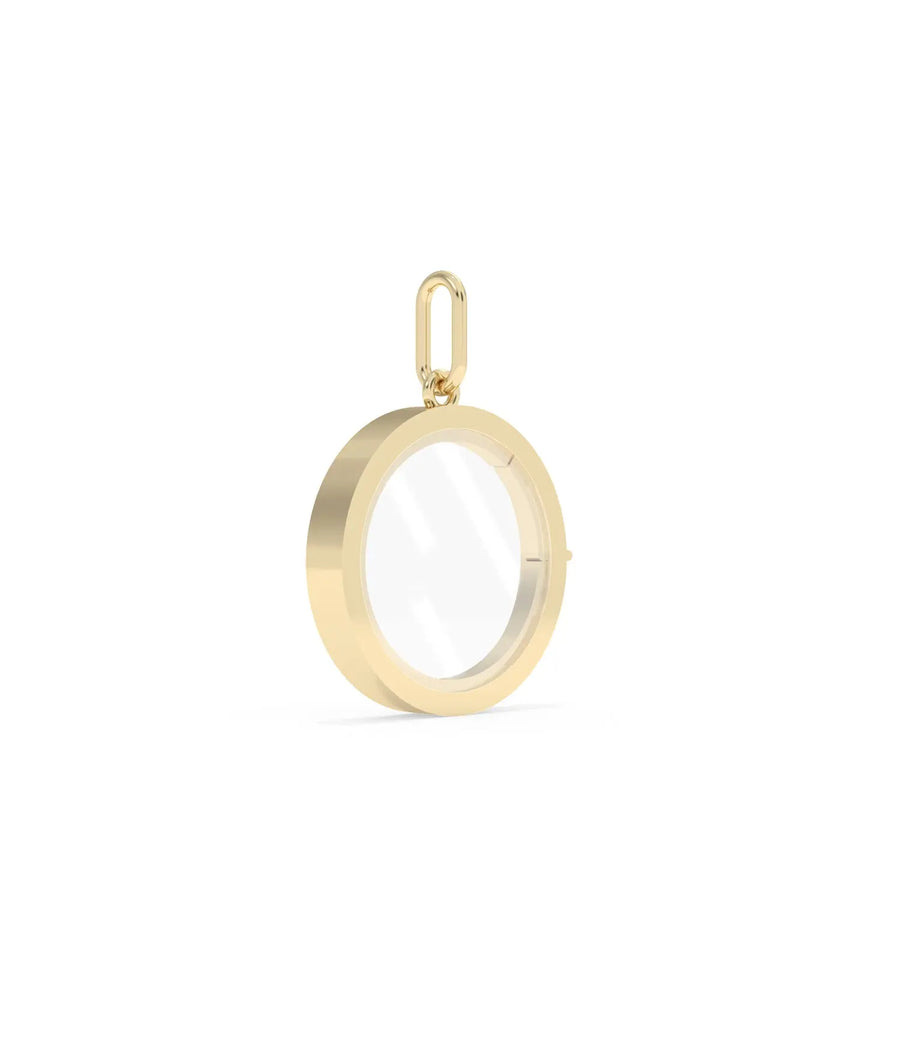 Side angle solid gold circle glass locket charm showing latch mechanism detail