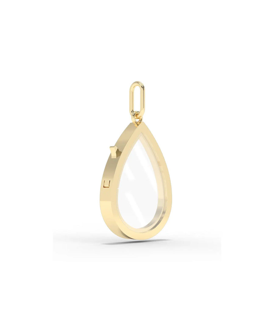 Side angle solid gold pear shape glass locket charm showing latch mechanism