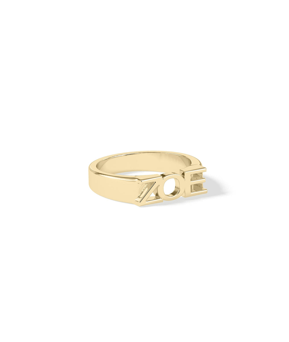 Custom initial ring showing bold letter design and gold craftsmanship