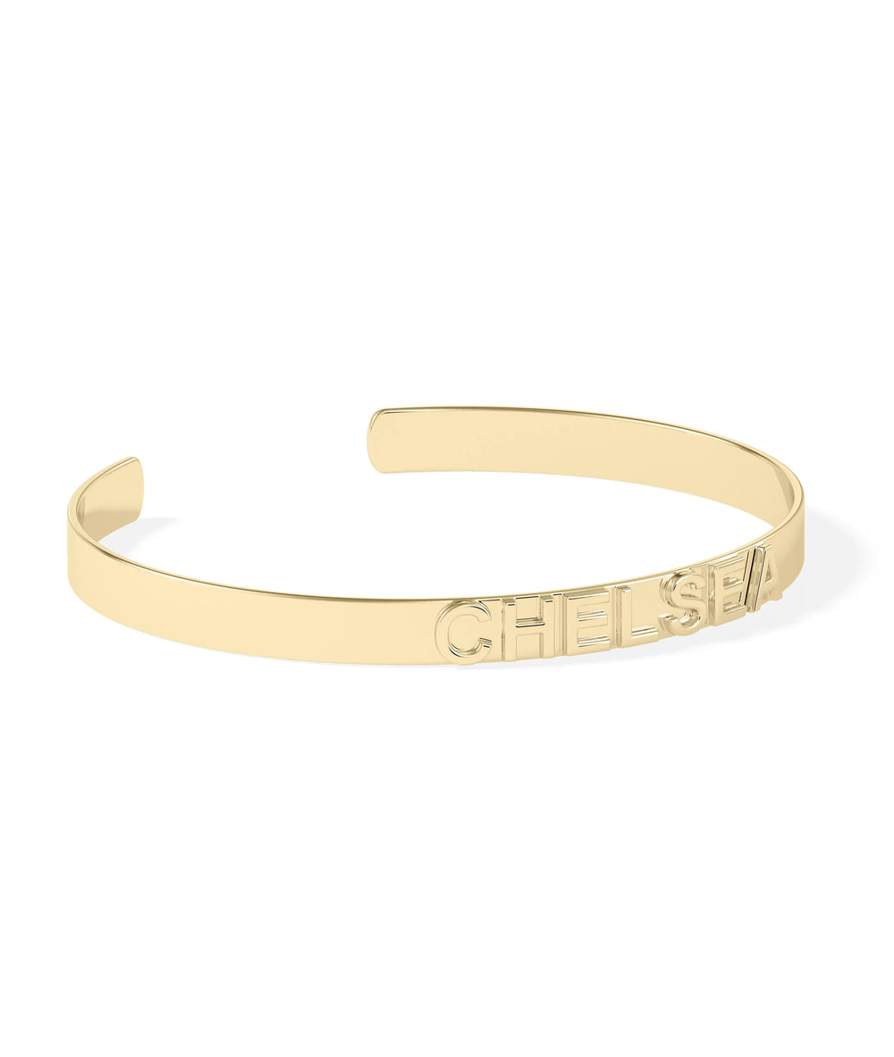 Custom name cuff bangle showing bold letter design and open back detail