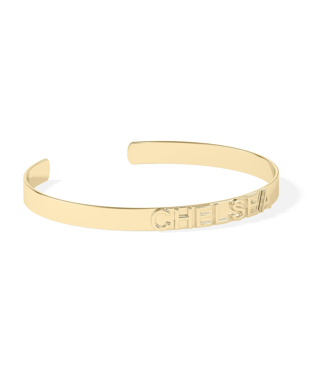 Custom name cuff bangle showing bold letter design and open back detail