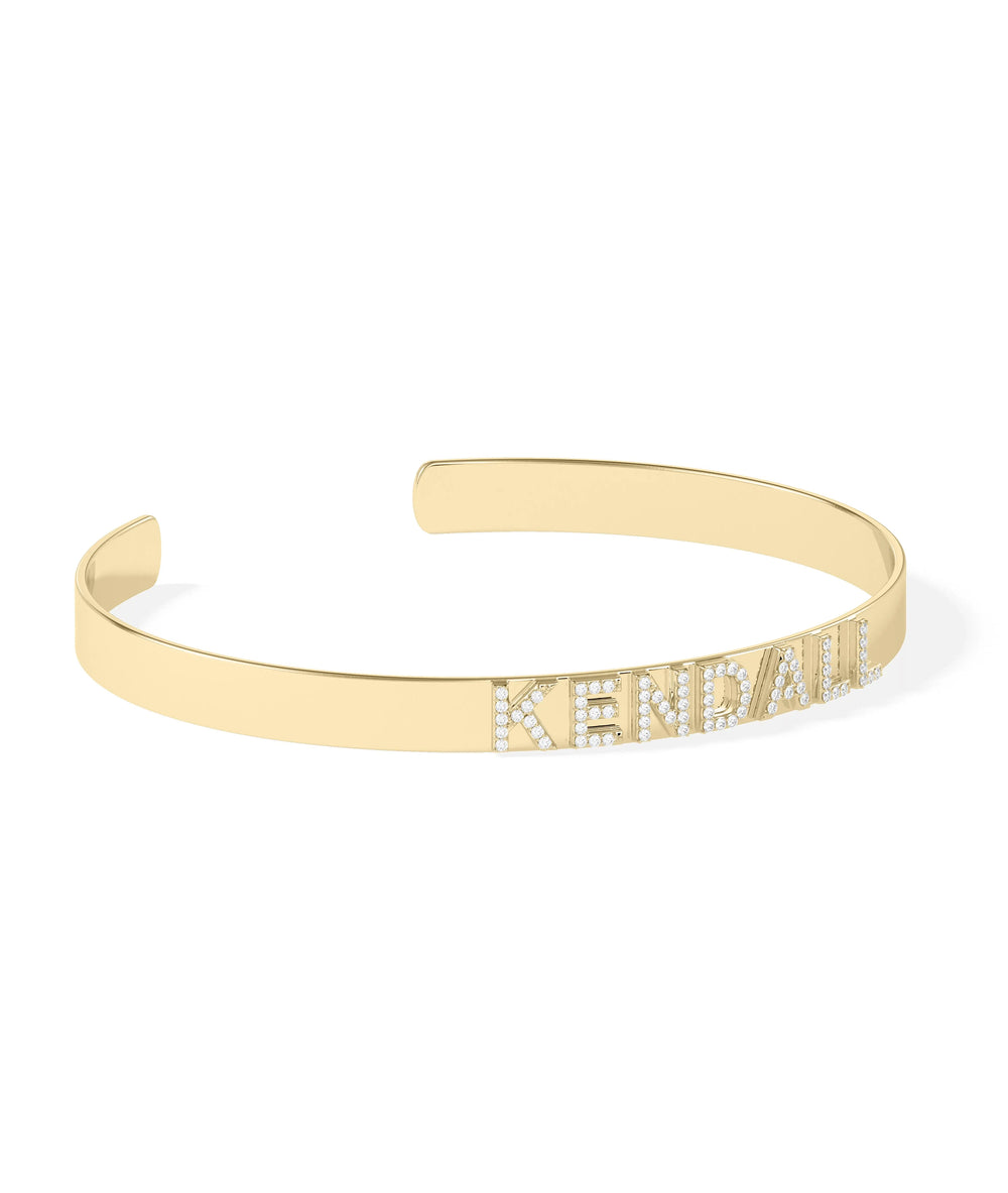 Custom diamond name cuff showing sparkling letter accents and gold design