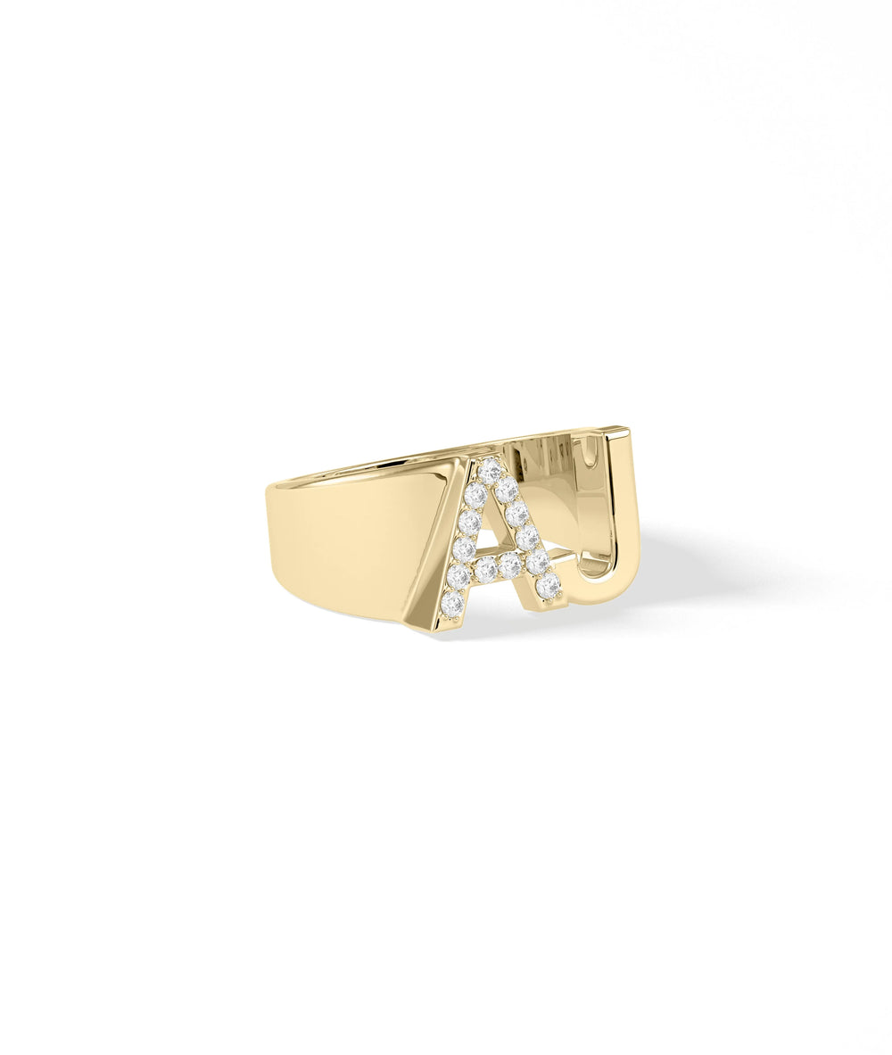 Statement diamond initial ring showing sparkle and oversized letter design