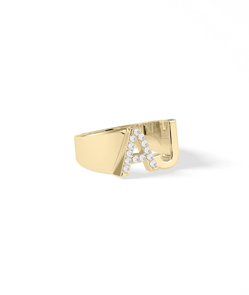 Statement diamond initial ring showing sparkle and oversized letter design
