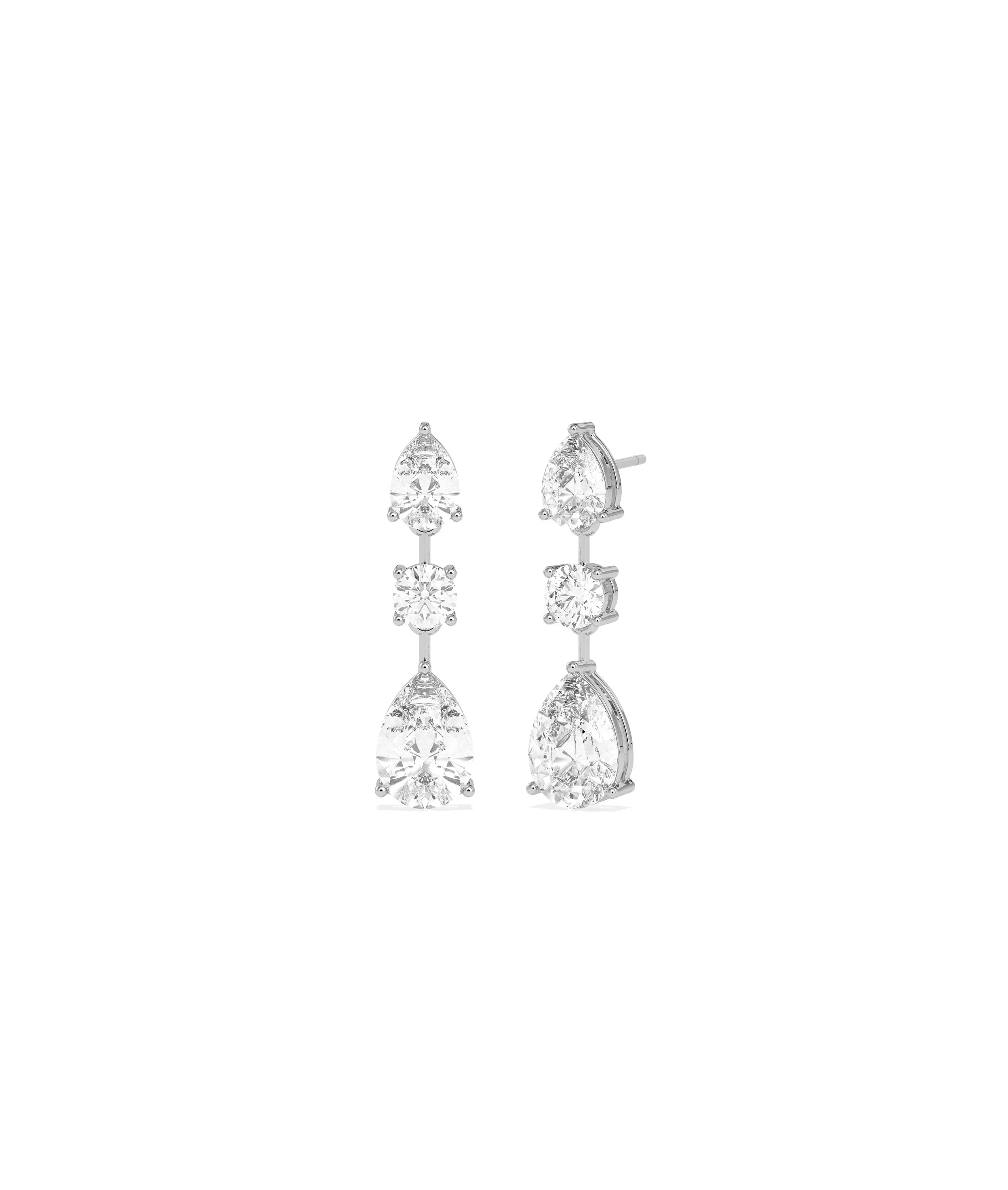 Close-up of Solitaire 3 Stone Dangle Earrings showing vertical arrangement