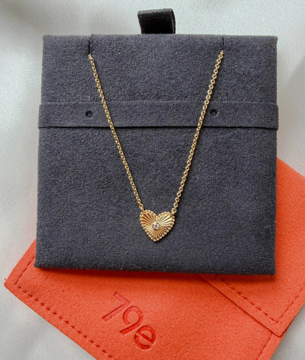 Close-up showing 10mm fluted heart with 0.01 Cttw diamond accent