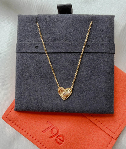 Close-up showing 10mm fluted heart with 0.01 Cttw diamond accent