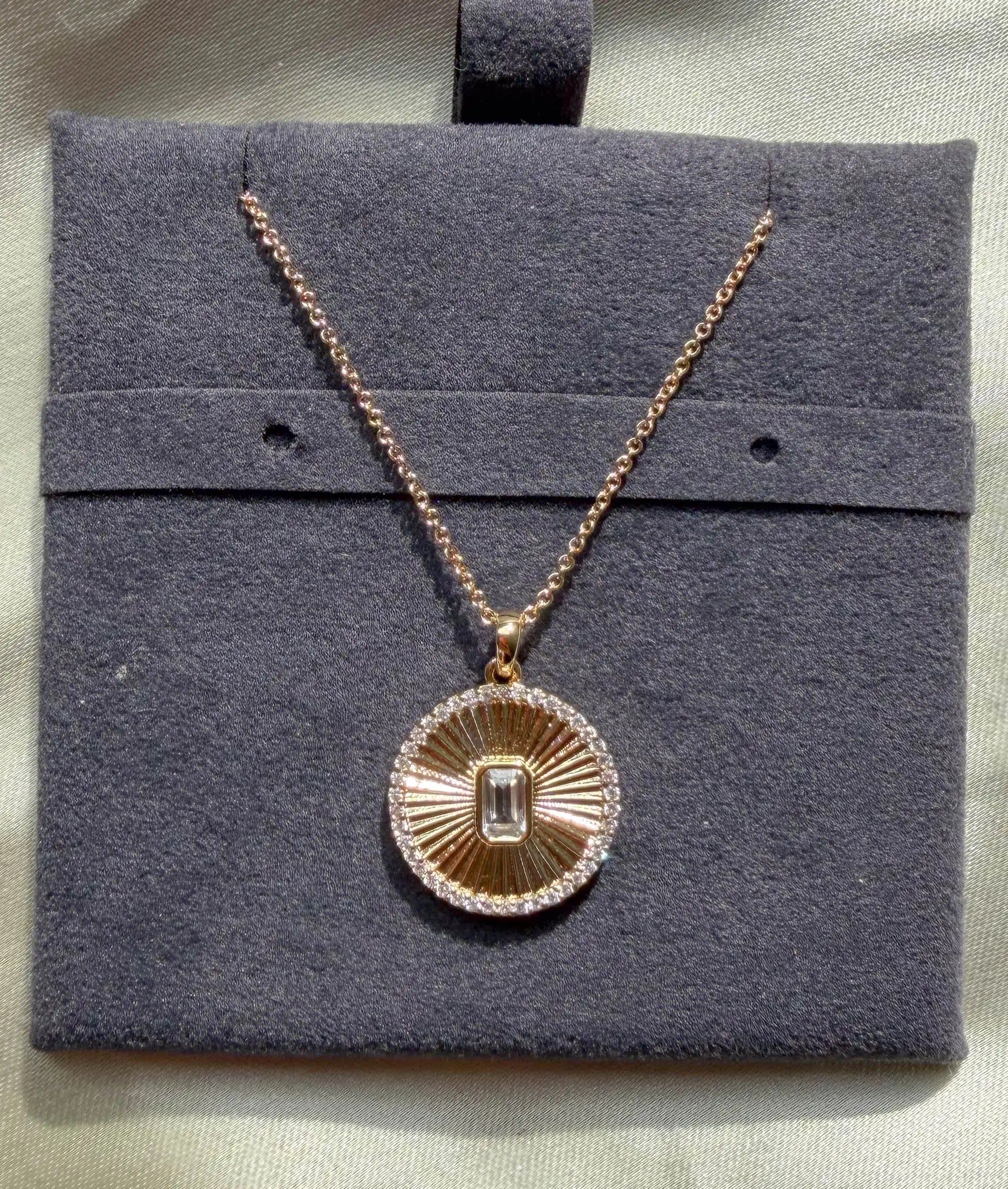 Close-up showing diamond outline border with custom shape center stone