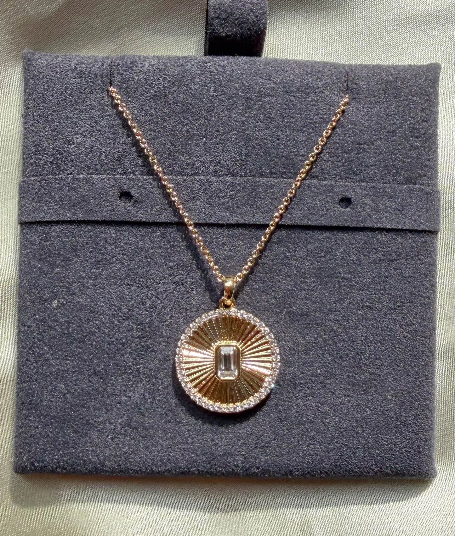 Close-up showing diamond outline border with custom shape center stone