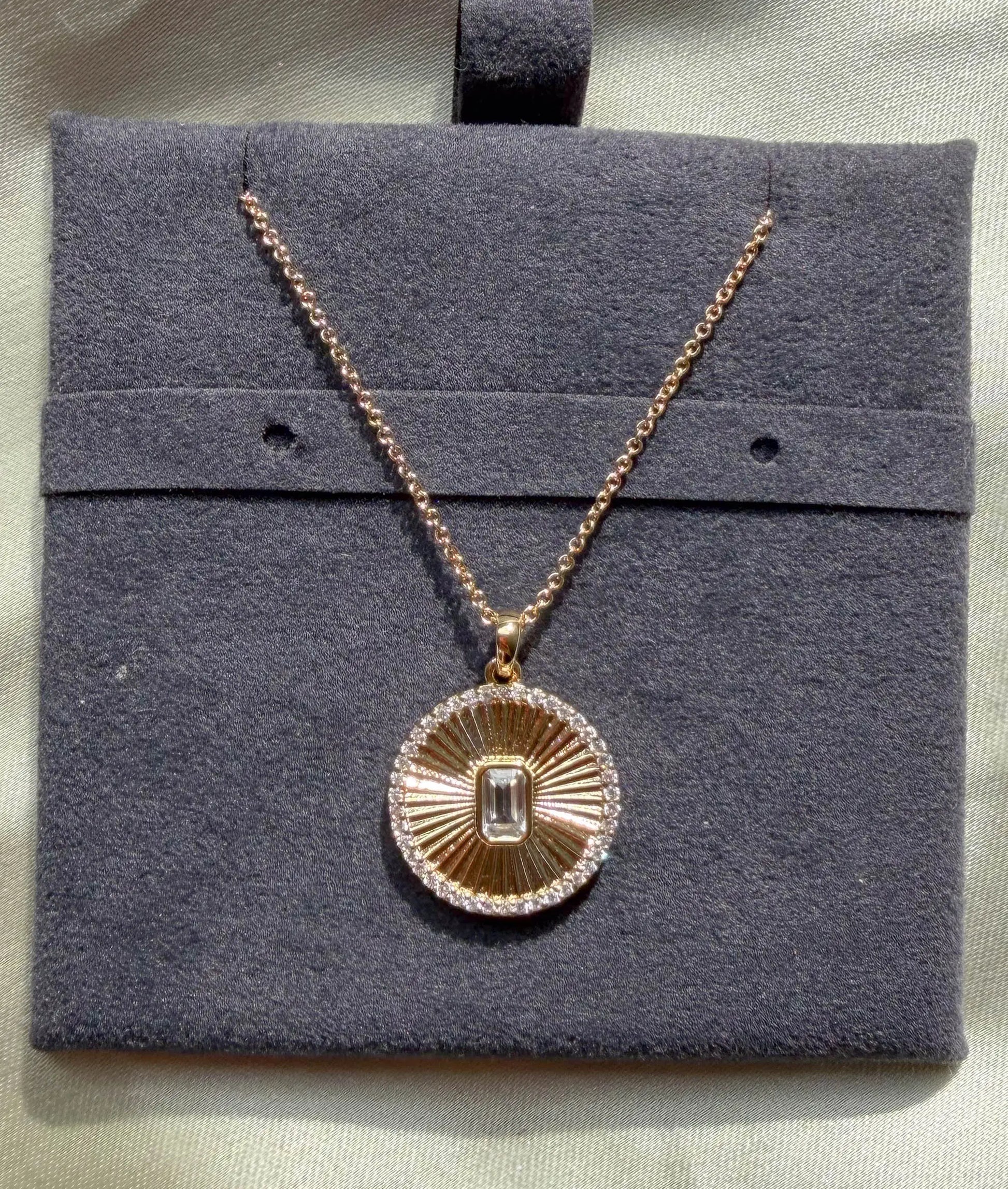 Close-up showing diamond outline border with custom shape center stone