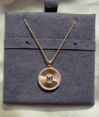 Close-up showing diamond outline border with custom shape center stone