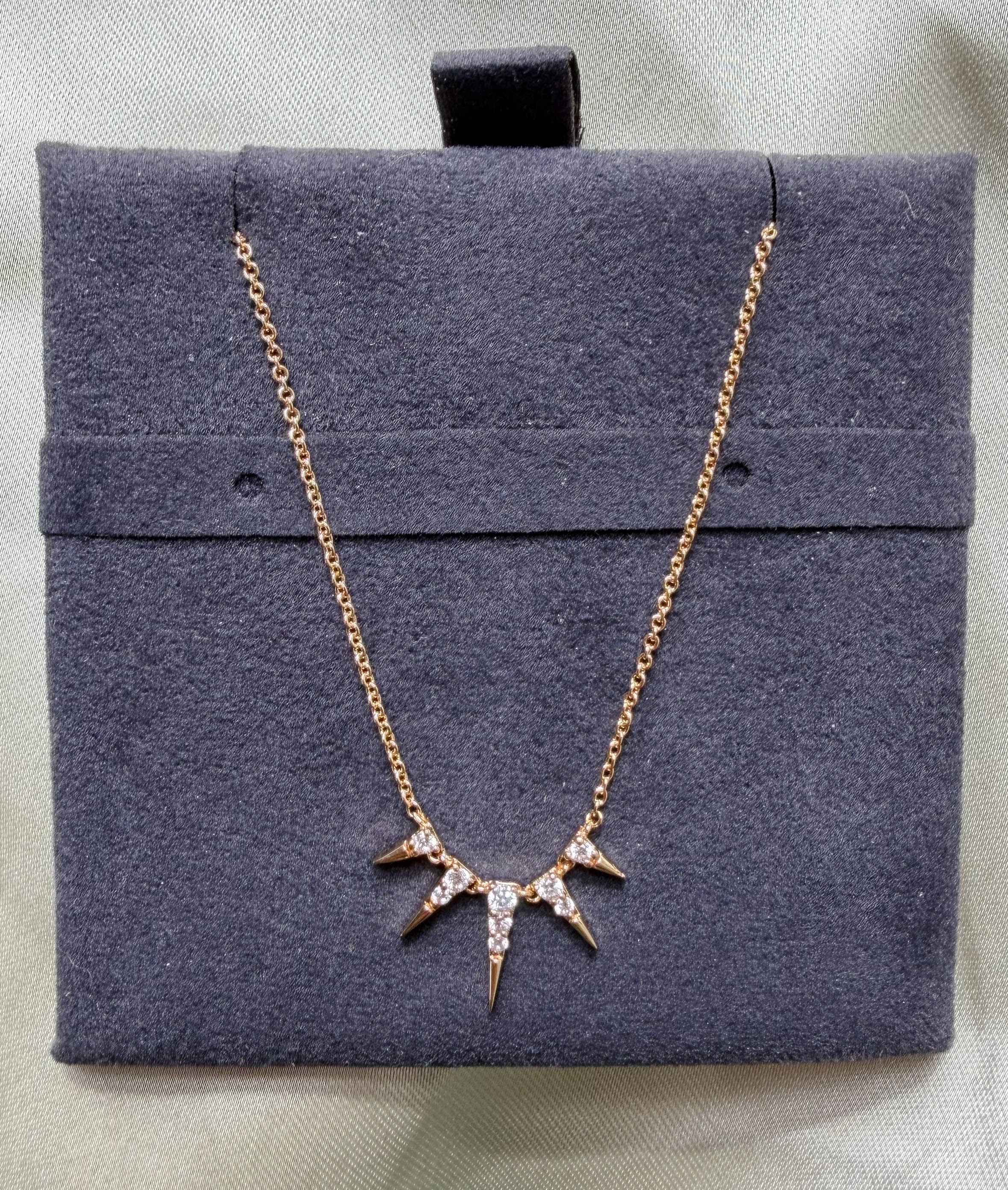 Close-up showing 21.50x11.00mm spikes with 0.13 Cttw diamond coverage