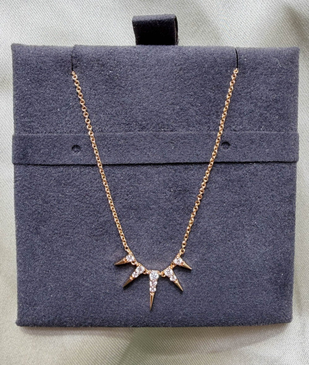 Close-up showing 21.50x11.00mm spikes with 0.13 Cttw diamond coverage