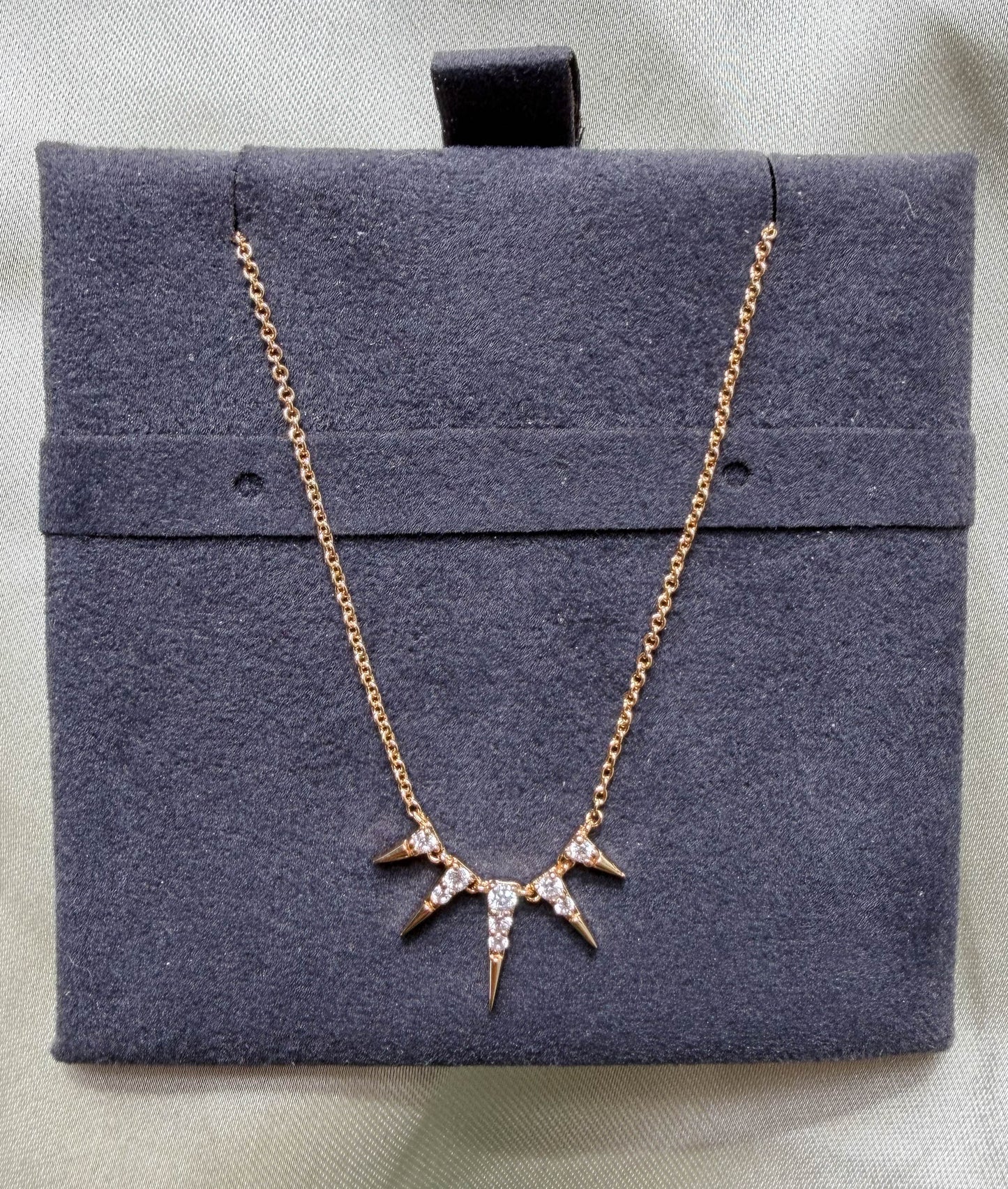 Close-up showing 21.50x11.00mm spikes with 0.13 Cttw diamond coverage