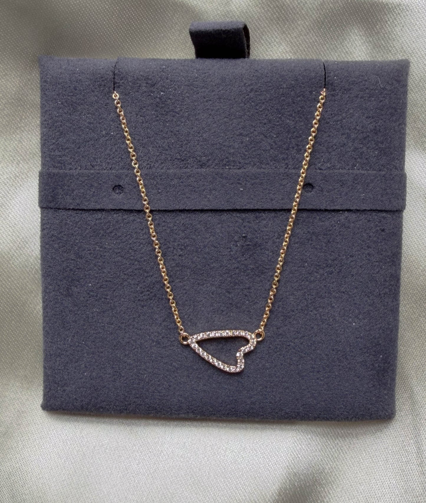 Abstract heart outline diamonds 13x8mm 0.13 ctw modern close-up