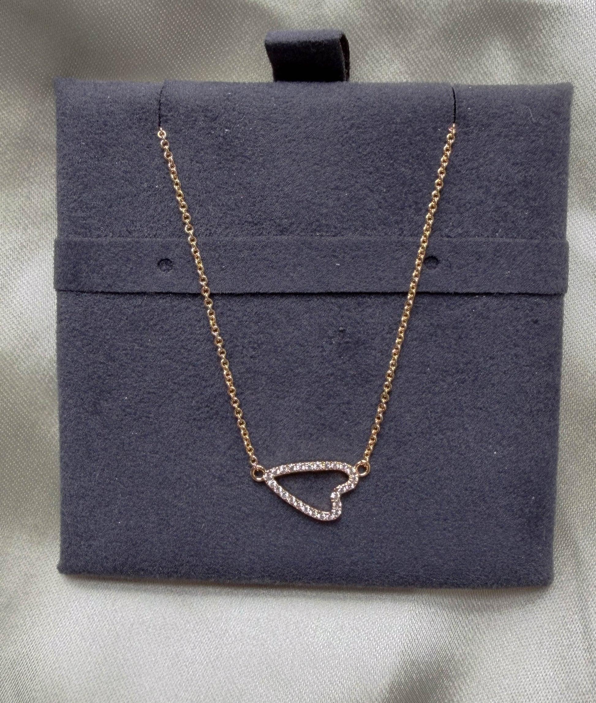 Abstract heart outline diamonds 13x8mm 0.13 ctw modern close-up