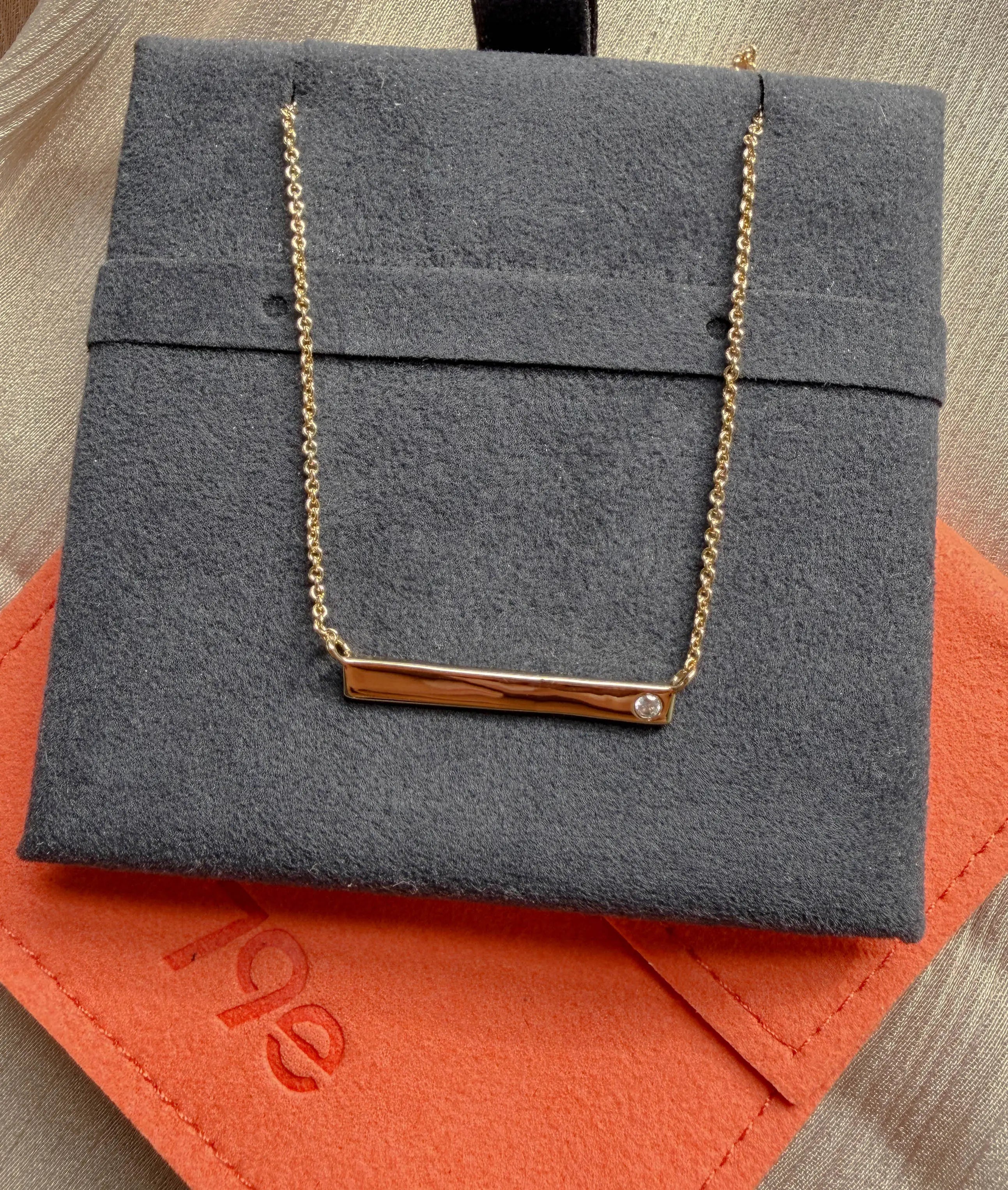 Close-up of 0.03 Cttw diamond on Gold Bar Necklace