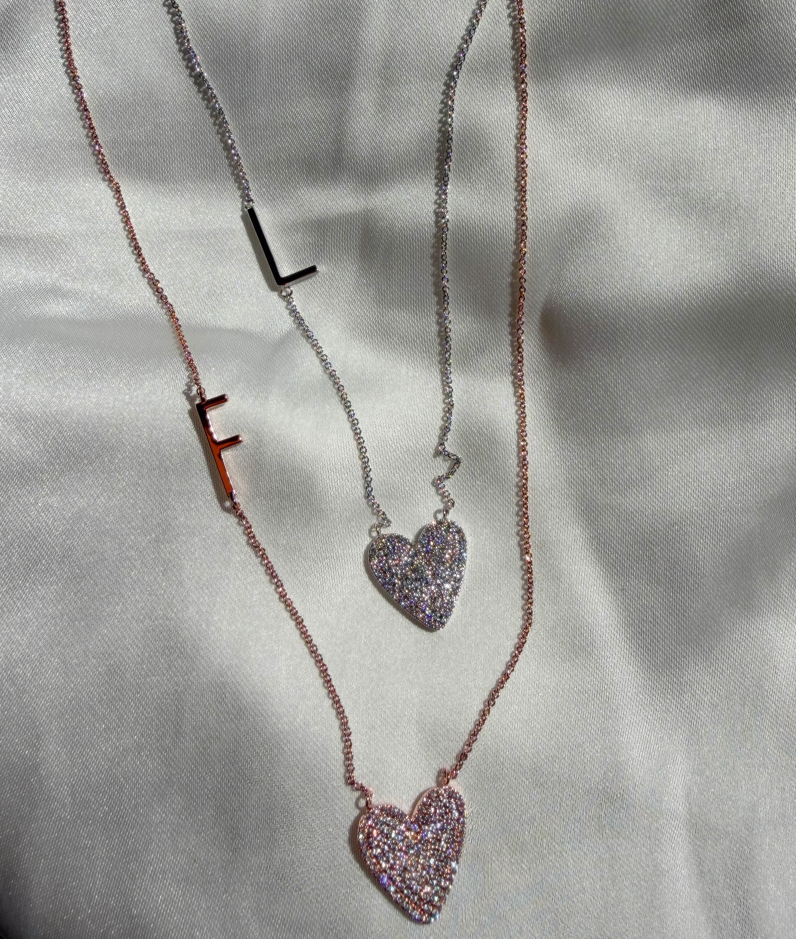 Sunken heart diamonds initial 16mm 15mm 0.47 ctw close-up