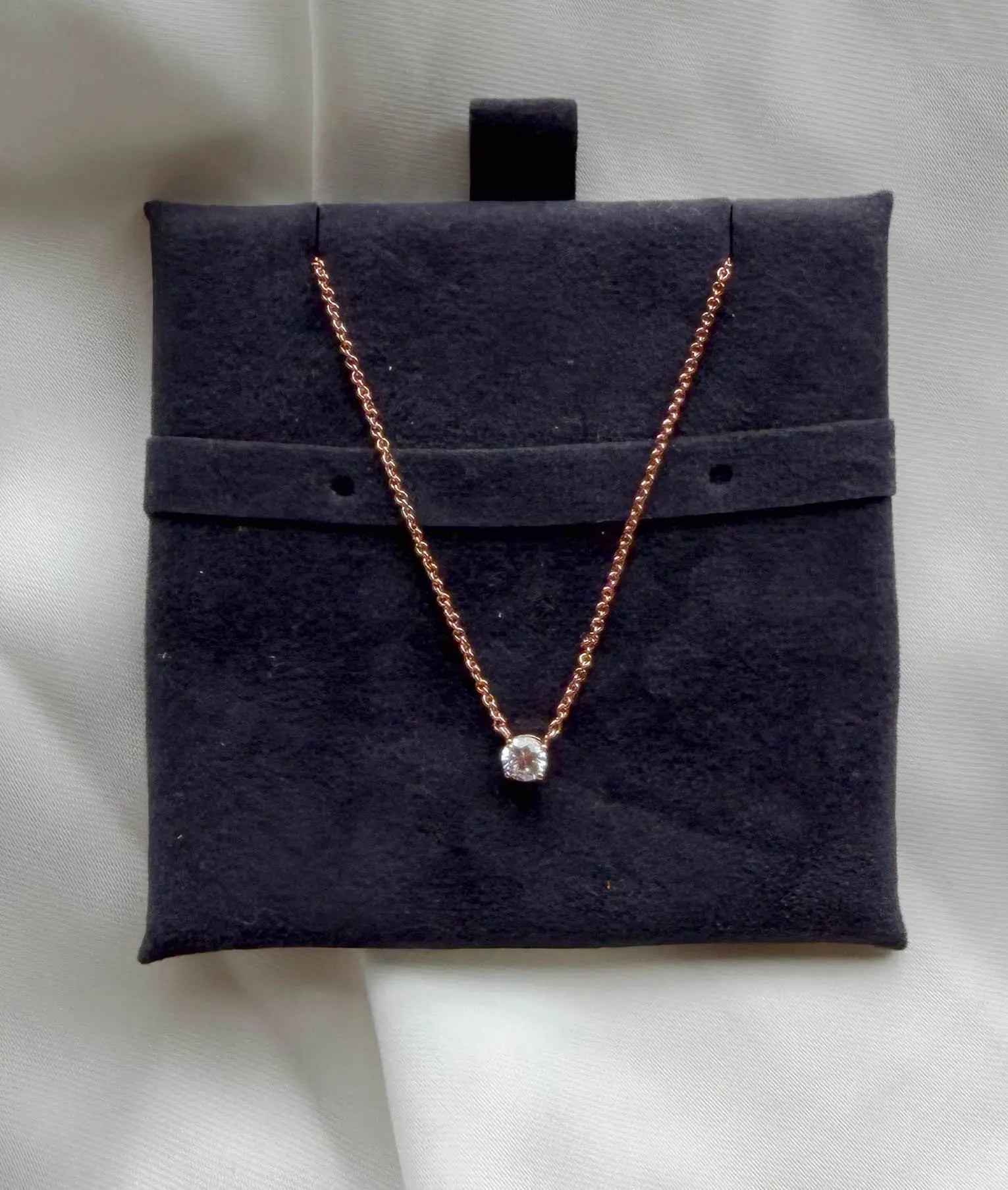 Solitaire Diamond Necklace worn on model, elegant everyday jewelry styling