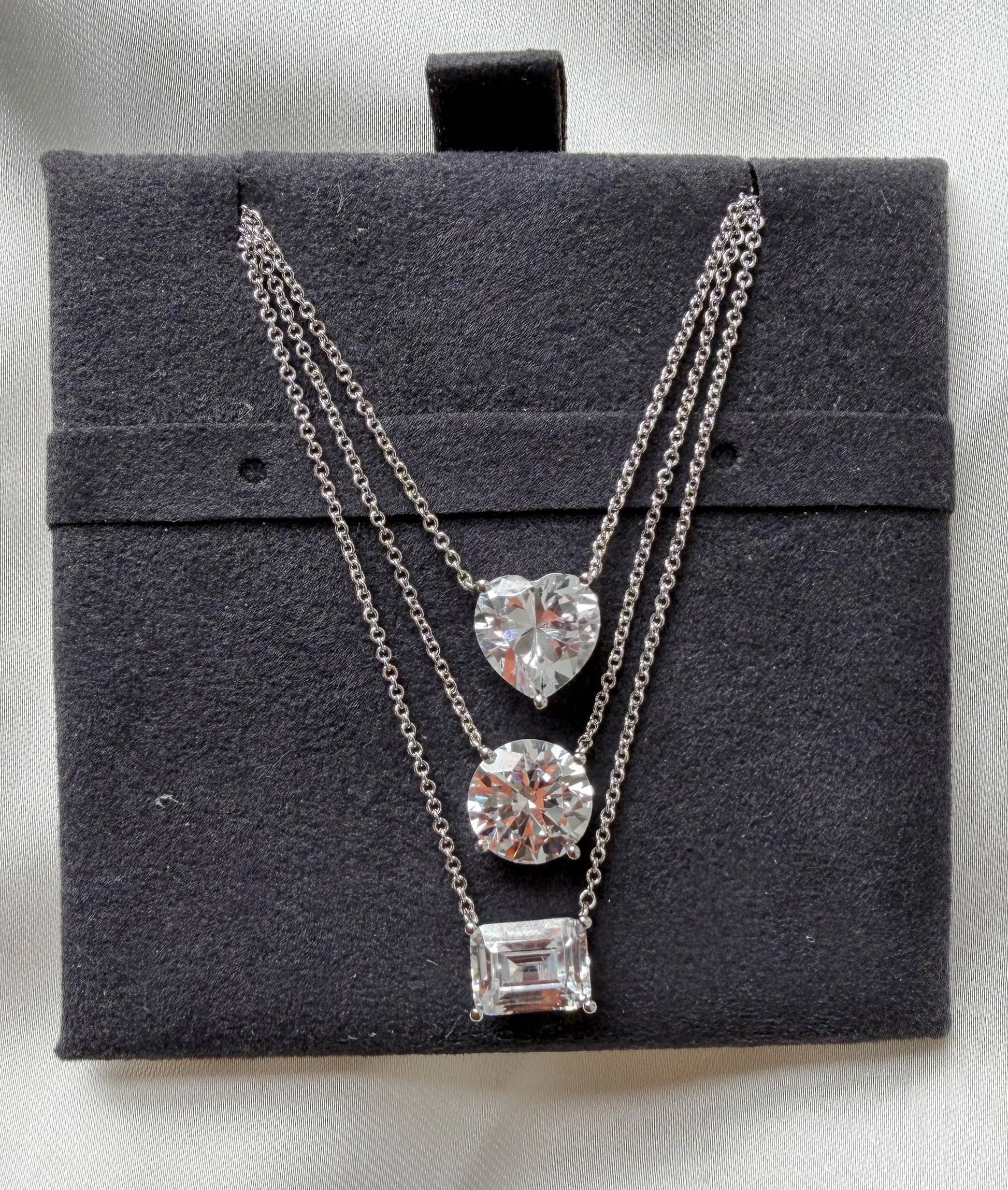 Solitaire Diamond Necklace side angle, brilliant cut diamond pendant detail