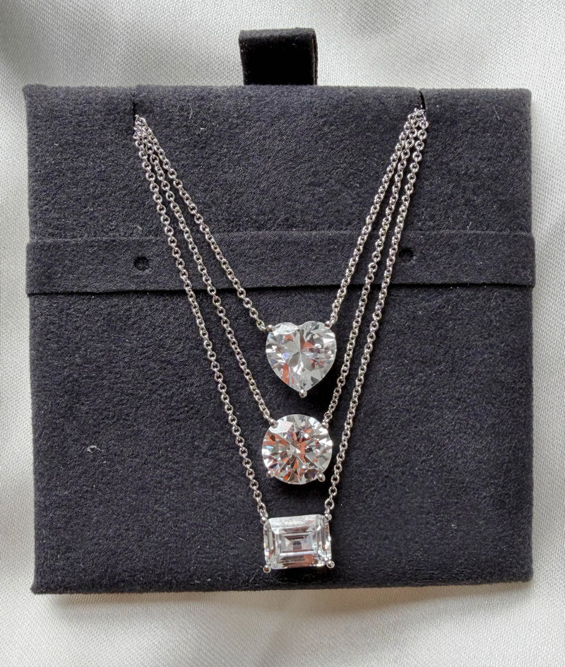 Solitaire Diamond Necklace side angle, brilliant cut diamond pendant detail