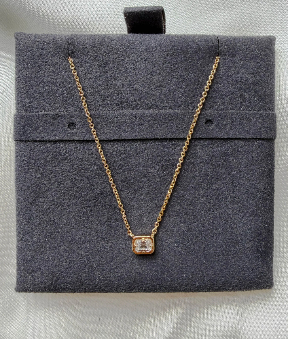 Bubble pendant showing dimensional gold frame and prong set diamond