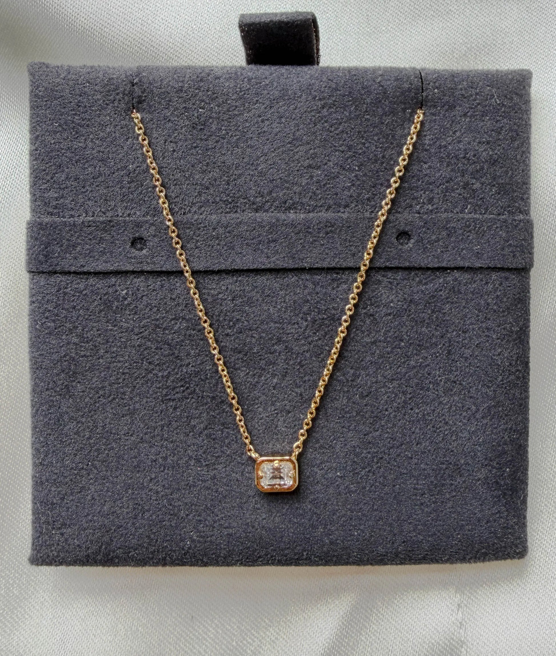 Bubble pendant showing dimensional gold frame and prong set diamond