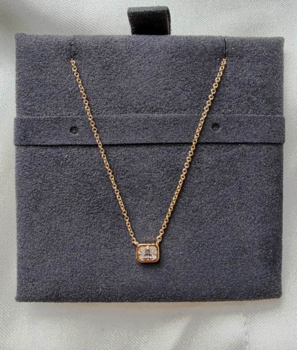 Bubble pendant showing dimensional gold frame and prong set diamond alternate view