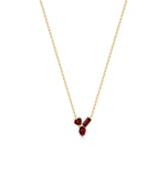 Multi shape 3 stone solitaire necklace in 14K yellow gold with garnet gemstones