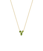 Multi shape 3 stone solitaire necklace in 14K yellow gold with peridot gemstones