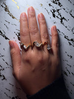 Model wearing wave pear lab diamond solitaire ring in yellow gold